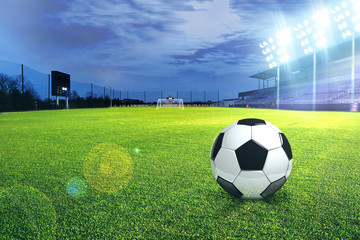 Fototapeta premium Football stadium soccer with football, lights at night 3d rendering