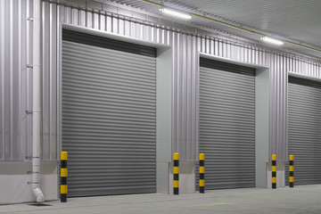 Obraz premium Roller door or roller shutter. Also called security door or security shutter with automatic system. For protection residential and commercial building i.e. house, warehouse, factory, shop and store.