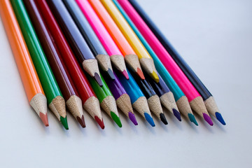 Color pencils on a white background, a line of colored pencils. Set of pencils. Children's creativity. Drawing with pencils