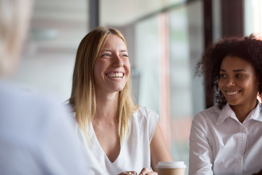 Happy Young Businesswoman Coach Mentor Leader Laughing At Group Meeting