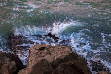 waves crashing on rocks