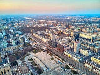 Fototapeta premium WARSAW, POLAND - APRIL 07, 2019: Beautiful panoramic aerial drone view to the center of Warsaw City in the sunset time in spring