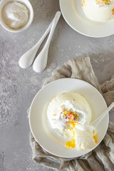 Cottage cheese dessert with apricot filling decorated with whipped cream. 