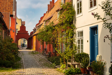 Fototapeta na wymiar Beautiful alley in the old town of Stralsund behind the Heiliggeistkloster