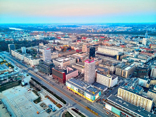 Fototapeta premium WARSAW, POLAND - APRIL 07, 2019: Beautiful panoramic aerial drone view to the center of Warsaw City in the sunset time in spring