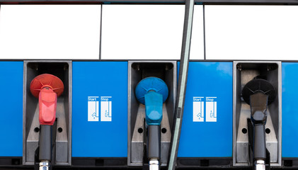 oil dispenser with monitor petrol station. different fuel nozzle of gasoline and diesel in service...