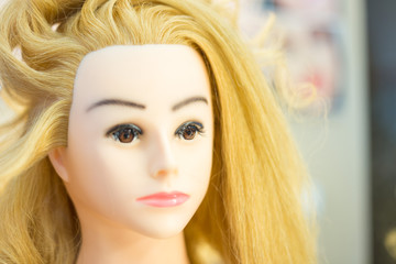 Training hairstyles on a mannequin