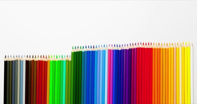 Animated clip from colored pencils - adding, moving up and shrinking multicolor set in row