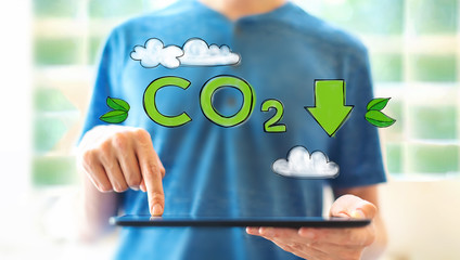 Reduce CO2 with young man using a tablet computer
