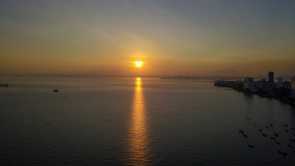 Naklejka premium aerial view of sunrise in Penang Malaysia near the beach