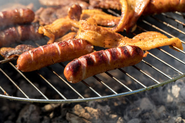 Unhealthy but tasty grilled sausages and meat