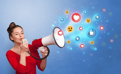 Person holding megaphone and yelling with social media concept
