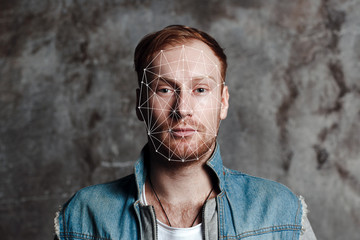 Facial recognition security system. Face augment mobile phone technology concept.