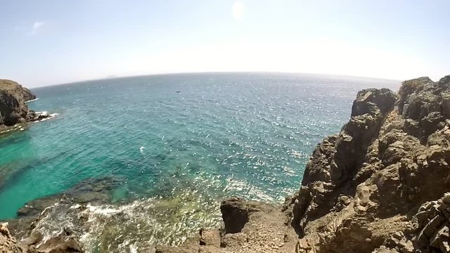 Pan at playas papagayos in lanzarote showing ocean and beautiful water.