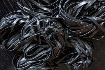 black pasta with cuttlefish ink. Pasta of durum wheat semolina with squid ink