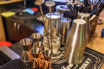  metal cups for making cocktails in an elite nightclub bar