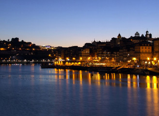 Obraz na płótnie Canvas A view of Porto by night from Vila Nova De Gaia, Portugal