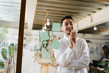 Environmental portrait of a furniture designer maker in his workshop