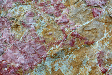 stone background. pink and gold
