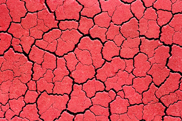 Fototapeta premium Cracked red wall patterns. Abstract background texture