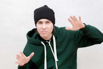 Posing white hip hop music artist.