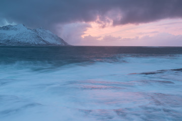 Amazing Sunset Over Mountain And Fjord, Winter Landscape, Norway The sun sets on the Norwegian Alps and the blue hour begins in range at Senja, Norway. Beautiful christmas time near Troms country. 