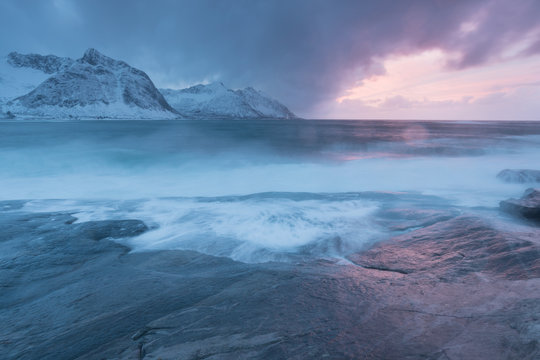 Amazing Sunset Over Mountain And Fjord, Winter Landscape, Norway The sun sets on the Norwegian Alps and the blue hour begins in range at Senja, Norway. Beautiful christmas time near Troms country. 