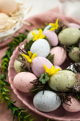 Obraz na płótnie Canvas Colored easter eggs on the table, background