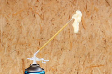 Spray can with foam which is used in construction.