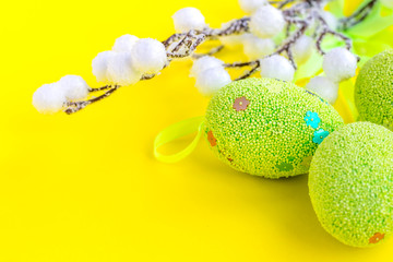 Easter background with eggs on yellow. Easter eggs