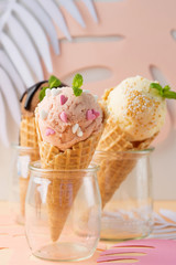 Waffle cones with strawberry, vanilla, chocolate ice cream