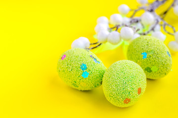 Easter background with eggs on yellow. Easter eggs