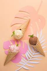 Waffle cones with strawberry, vanilla, chocolate ice cream