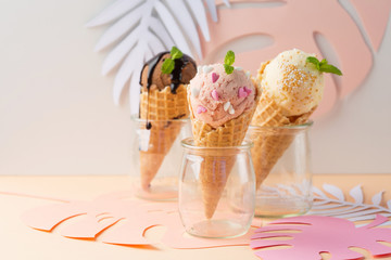 Waffle cones with strawberry, vanilla, chocolate ice cream