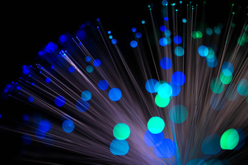 Abstract, intentionelly defocused lights on optical fibres , technology background image