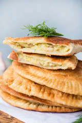Homemade chebureks with potatoes. Of diet food. Pies with potatoes and mushrooms.