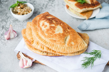 Homemade chebureks with potatoes. Of diet food. Pies with potatoes and mushrooms.