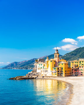 Scenic Mediterranean riviera coast. Panoramic view of Camogli town in Liguria, Italy. Basilica of Santa Maria Assunta and colorful palaces. Liguria, Italy