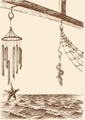 Wind chimes on the porch of a beach house. Sea view in the background