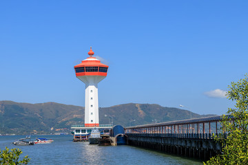 Naklejka premium Lighthouse on Andaman sea, custom and immigration office at border to Myanmar, Ranong, Thailand.