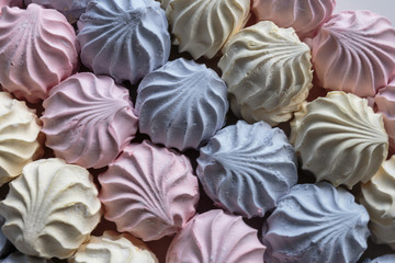 Multicolor fruity zephyr. Closeup of dessert with raspberry, blueberry and banana flavor. Natural product, ready for sale.