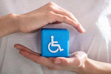 Human Protecting Cubic Block With Disabled Handicap Icon