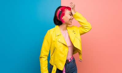 Young woman with yellow jacket has just realized something and has intending the solution