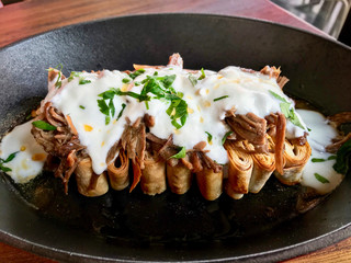Turkish Food Silor / Siron / Ziron Rolled Raw Dough and Fried Phyllo with Yogurt and Meat Homemade Food.