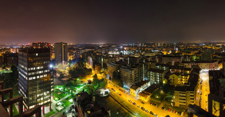 Fototapeta na wymiar Panorama of Milan skyline at night.Via Nervesa, Milan, Italy
