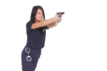 young woman police officer with a pistol