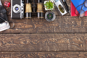 items and accessories for the traveler on the old background on the table