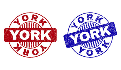 Grunge YORK round watermarks isolated on a white background. Round seals with grunge texture in red and blue colors. Vector rubber imitation of YORK tag inside circle form with stripes.