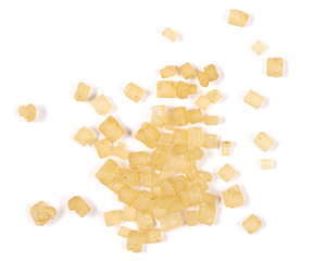 Macro brown cane sugar pile isolated on white background and texture, top view