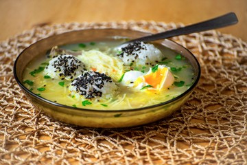 Soupe with rice, noodle and poached egg, rich and healthy low-calorie japanese meal..
